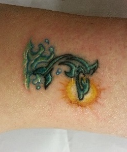 Illustration for article titled My poor sad dolphin tattoo got a face-lift